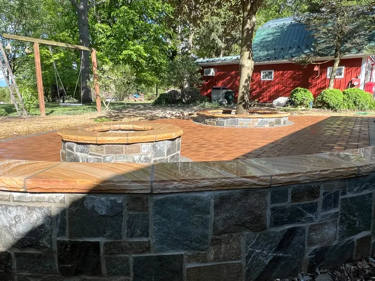 Round fire pit on wall terrace