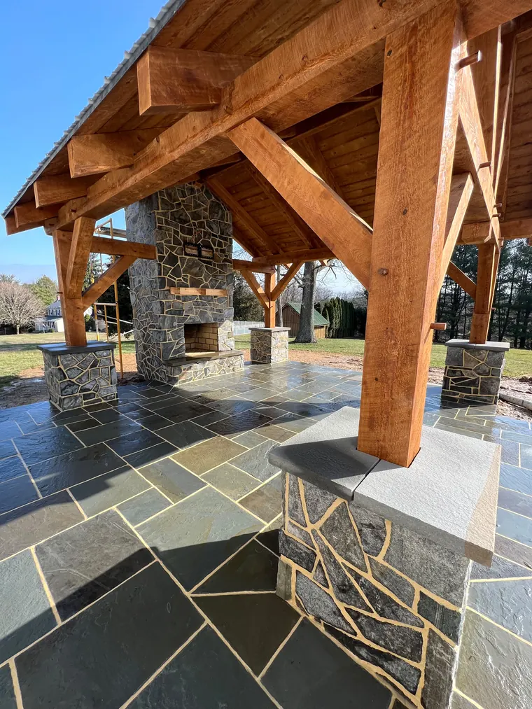 Timber pavilion frame with stone fireplace